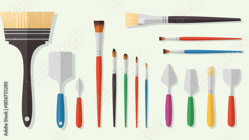 A diverse collection of artist paintbrushes and spatulas for creative projects.