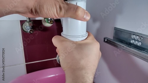 Plumber cleaning a clogged drain in the sewer