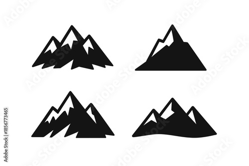 Set of four black mountain icons on a dark background