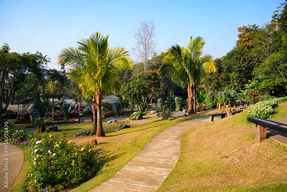 Obraz premium Walkway in the Mae Fah Luang Garden with vibrant floral terraces in Doi Tung near Chiang Rai, Northern Thailand