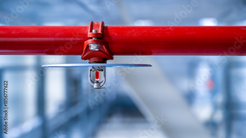 fire sprinkler on red fire pipe