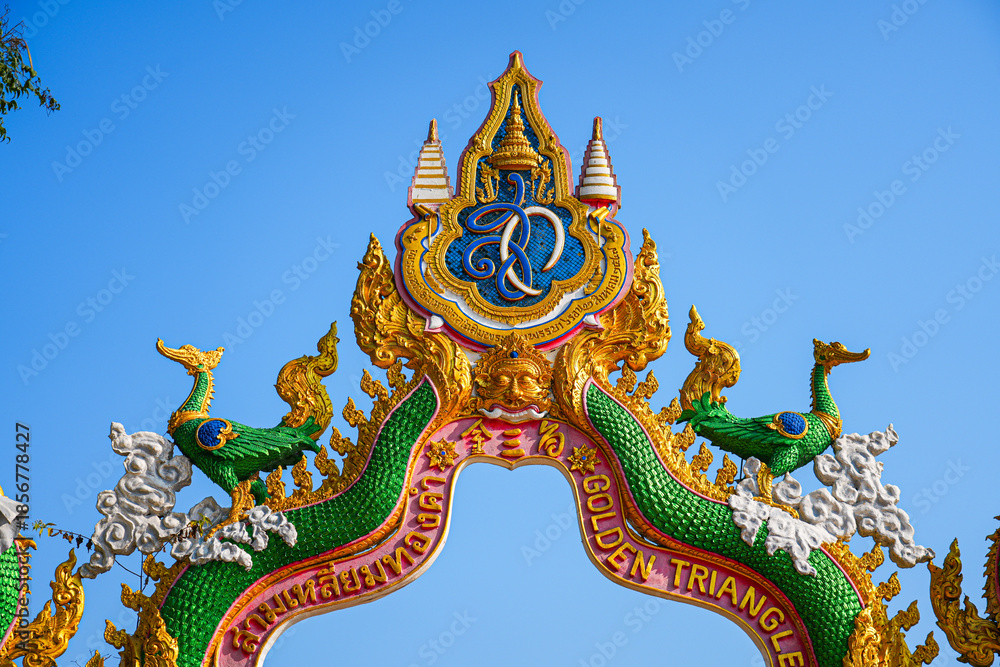 Fototapeta premium Ornate Lanna-style gateway at the Golden Triangle Park (Sop Ruak) on the banks of the Mekong River in Chiang Saen in Northern Thailand