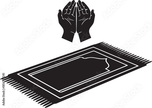 Islamic prayer rug and hands in supplication silhouette