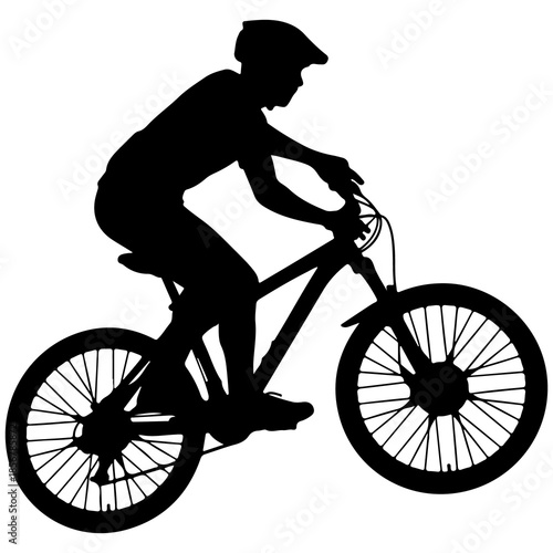 Silhouette of a person riding a mountain bike with helmet bicycle rider