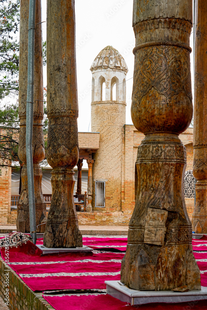 Fototapeta premium Carved wooden column in the Dorus-Saodat Complex : Timurid Dynasty's royal burial site in Shakhrisabz, Uzbekistan, Central Asia