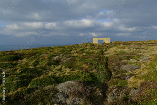 Les Landes, Jersey, U.K. Non descript WW2 bunker among Winter heather.