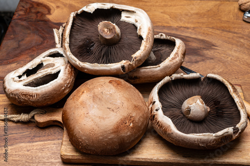 Tasty vegetarian food, large brown champignons Agaricus bisporus portobello mushrooms close up