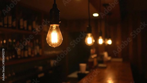 Edison Bulbs in Bar: Warm, inviting ambiance created by a row of vintage Edison bulbs, casting a golden glow over a dimly lit bar, evoking a sense of nostalgic charm.