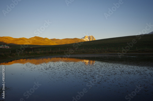 A mountain lake used to water livestock.