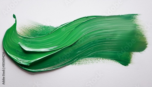 abstract green paint stroke on white canvas creates textured artistic expression