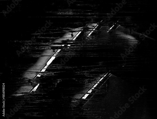 A dark abstract artwork with glitch distortion effect in black and white monochrome