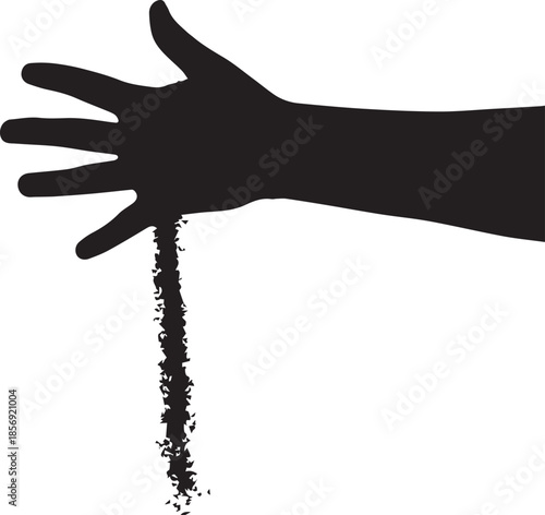 Silhouette of hand pouring small particles downwards