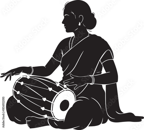 Indian woman playing traditional tabla drum sitting down