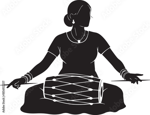 Indian woman playing traditional drum sitting cross-legged