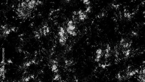 Old monochrome grunge background with dots, scratches and splats of paint. Backdrop with spots, cracks, dots, chips. Monochrome print 