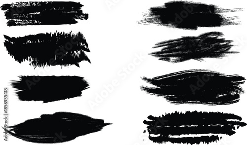 Collection of black brush strokes and smudges on white background for design and art