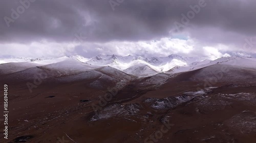 Snowy Mountain Range Kyrgyzstan Storm Clouds Aerial View