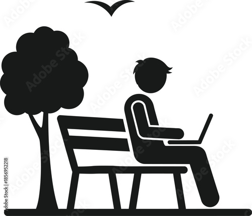 Person working on laptop in park