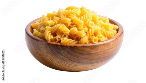 A wooden bowl filled with uncooked yellow fusilli pasta against a solid black background.