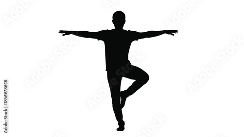A person in a yoga pose arms outstretched balanced in a silhouette
