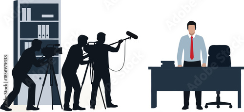 Video production crew films a businessman standing behind his desk in an office setting.