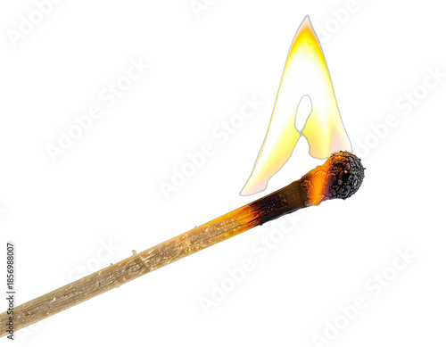 Close-up of a lit match burning brightly against a black background