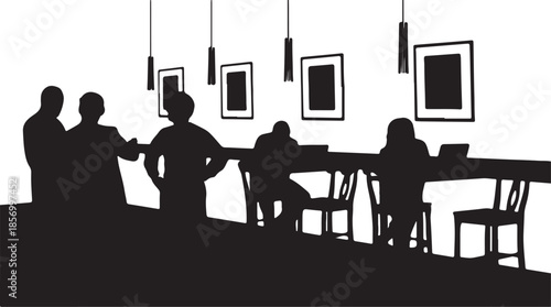 People collaborate and work at a long table in a stylish contemporary office or shared space