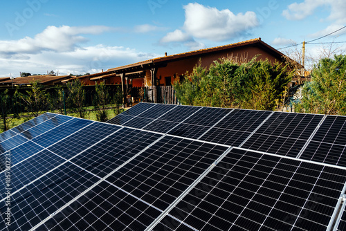Εκτύπωση καμβά Solar panels installed on a rooftop, capturing sunlight in a residential area, s