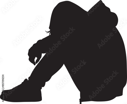 Silhouette of a person in a hooded sweatshirt hunched over with knees pulled to chest, conveying feelings of sadness, isolation, or contemplation against a stark white also transparent background