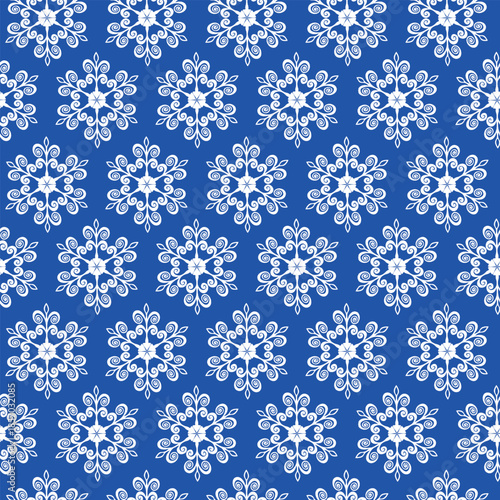 Winter seamless pattern with snowflakes, holiday background. Vector illustration for fabric, textile wallpaper, posters, gift wrapping paper. Christmas vector illustration. Falling snow.