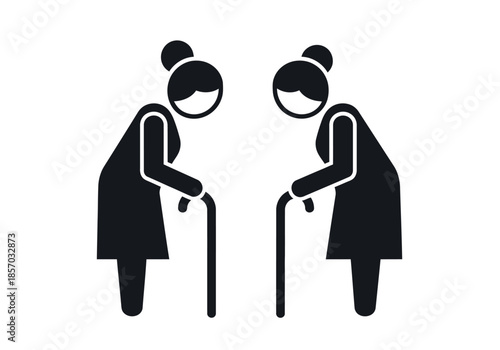 Two elderly women depicted as silhouettes each using a walking cane for support high-quality professional