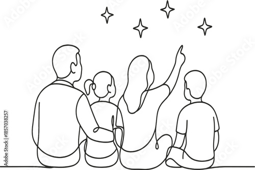 Family of four sitting together and looking up at the starry night sky