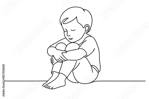 Sad little boy sitting alone with knees hugged to chest, eyes closed, feeling lonely