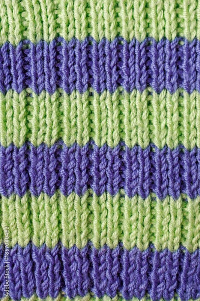 Fototapeta premium Close up textured hand knitting pattern rib 2x1 made of wool yarn for relaxing hobby background