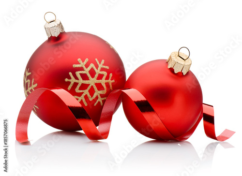 Two red Christmas decoration baubles and curling paper ribbon isolated on white background