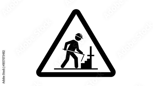 A black and white triangular warning sign depicting a worker with a hard hat and tool, indicating construction or road work ahead.