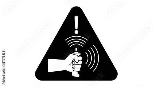 A black triangular warning sign with a white exclamation mark and a hand holding a device emitting waves.