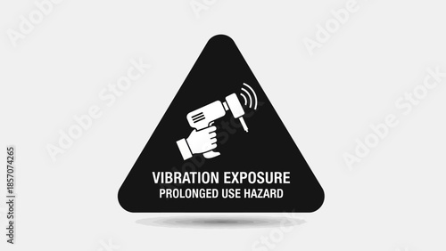 Black triangular warning sign with white icon of hand holding vibrating power tool and text 'VIBRATION EXPOSURE PROLONGED USE HAZARD' on a light grey background.