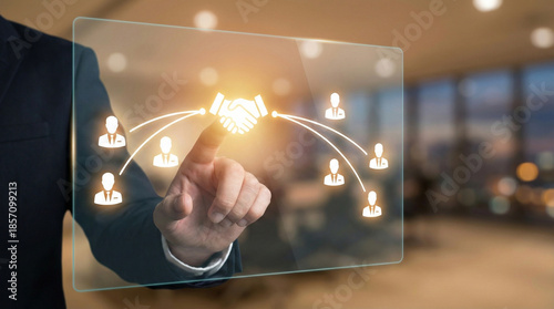 Businessman touching virtu screen with connecting to people icons. This represents global business networking, partnership, and virtual team collaboration
