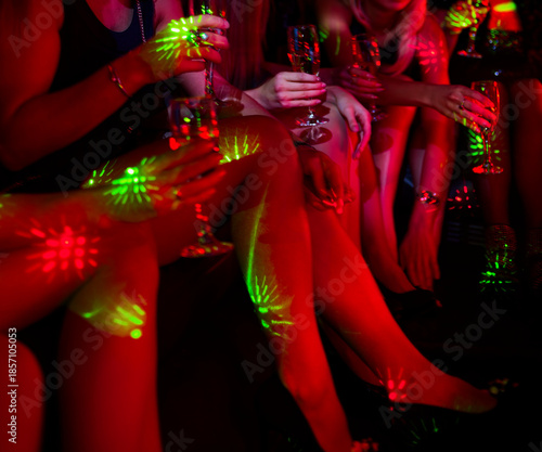 Wallpaper Mural Celebration: Group of Women Toasting with Champagne in Nightclub Under Vibrant Dance Floor Lights Torontodigital.ca