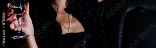 Wallpaper Mural Nightlife Celebration: Woman in Stylish Attire Holding Cocktail with Relaxed Pose in Luxurious Lounge Setting Copyspace Torontodigital.ca