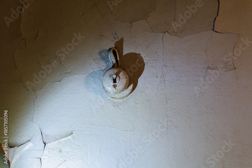 Wallpaper Mural Rustic Charm: Vintage Light Switch on Weathered Wall With Peeling Paint Creating a Nostalgic and Industrial Atmosphere Torontodigital.ca