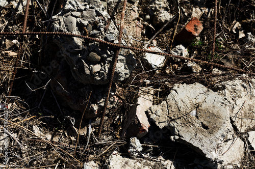 Urban Decay: Crumbled Concrete and Rusty Reinforcement Bars in Grunge Construction Site Close-up