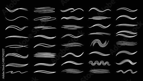 Collection of various white chalk and paint brush strokes.