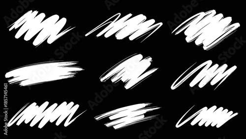 Set of nine hand drawn white scribble brush strokes on black background.