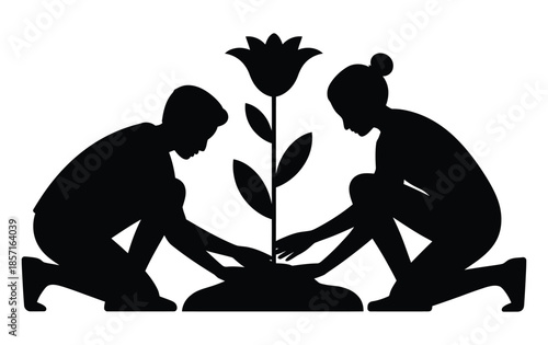 Silhouettes of two people planting a flower in the ground together.