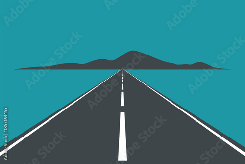 A long, straight asphalt road stretches towards a distant, silhouetted mountain range under a clear sky.