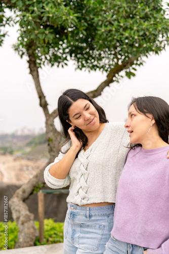 Close friends enjoying conversation outdoors