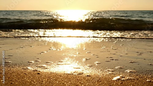 Sun Kissed Waves beach sparkle summer Close up of gentle ocean waves sparkling under bright summer sunlight, creating shimmering