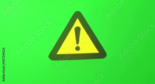 Yellow Warning Triangle Icon on Vibrant Green Screen